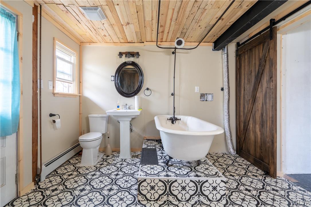 1234 Sunset Circle Slatington, PA 18080 - Photo 16 of 40 a bathroom with a sink a toilet and a mirror