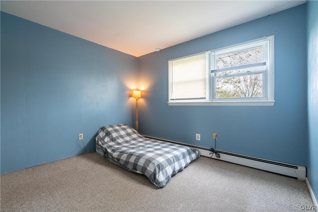 1234 Sunset Circle Slatington, PA 18080 - Photo 24 of 40 a bedroom with a bed lamp and window