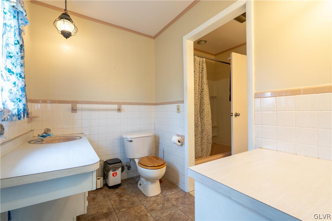 1234 Sunset Circle Slatington, PA 18080 - Photo 29 of 40 a bathroom with a sink and a toilet