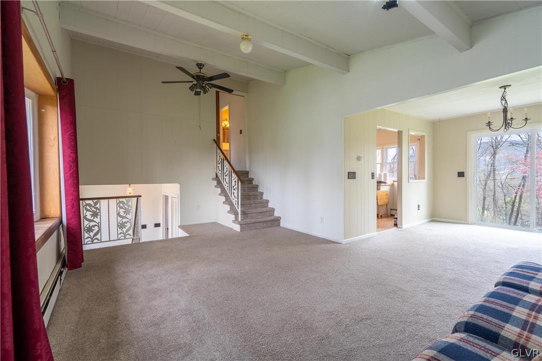 1234 Sunset Circle Slatington, PA 18080 - Photo 10 of 40 a view of a hallway with a couch and chandelier