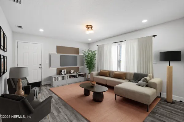 a living room with furniture and a window