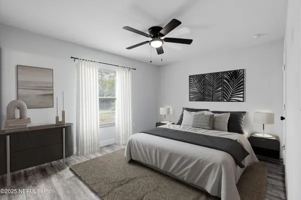 a bedroom with a bed and window