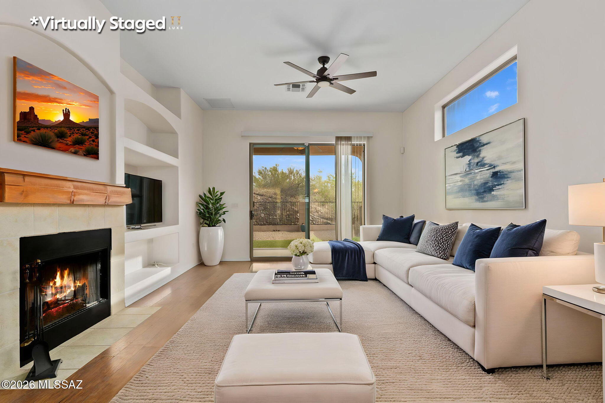 13668 East High Plains Ranch Street Vail, AZ 85641 - Photo 17 of 51 a living room with furniture a flat screen tv and a fireplace