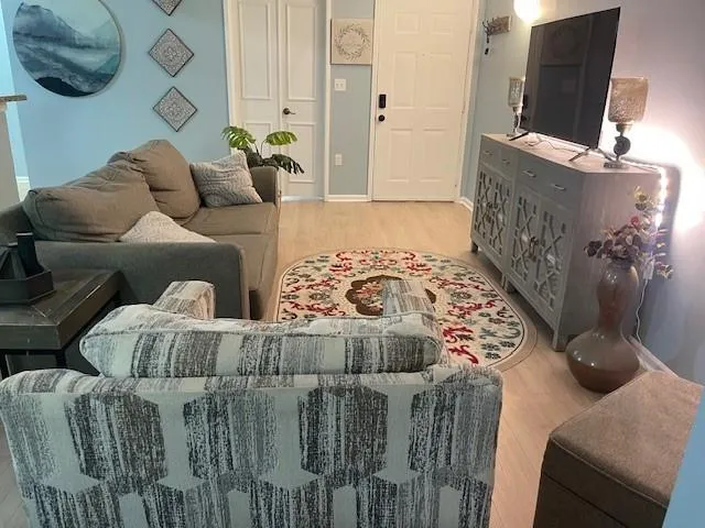 a living room with furniture and a flat screen tv