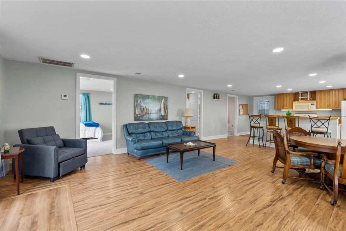 1048 16th Street Dickinson, TX 77539 - Photo 14 of 28 a living room with furniture and a wooden floor