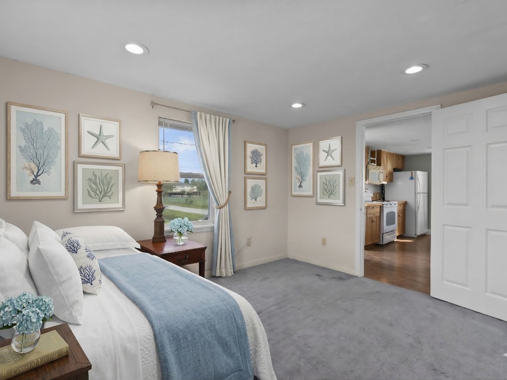 1048 16th Street Dickinson, TX 77539 - Photo 18 of 28 a bedroom with a bed and a couch