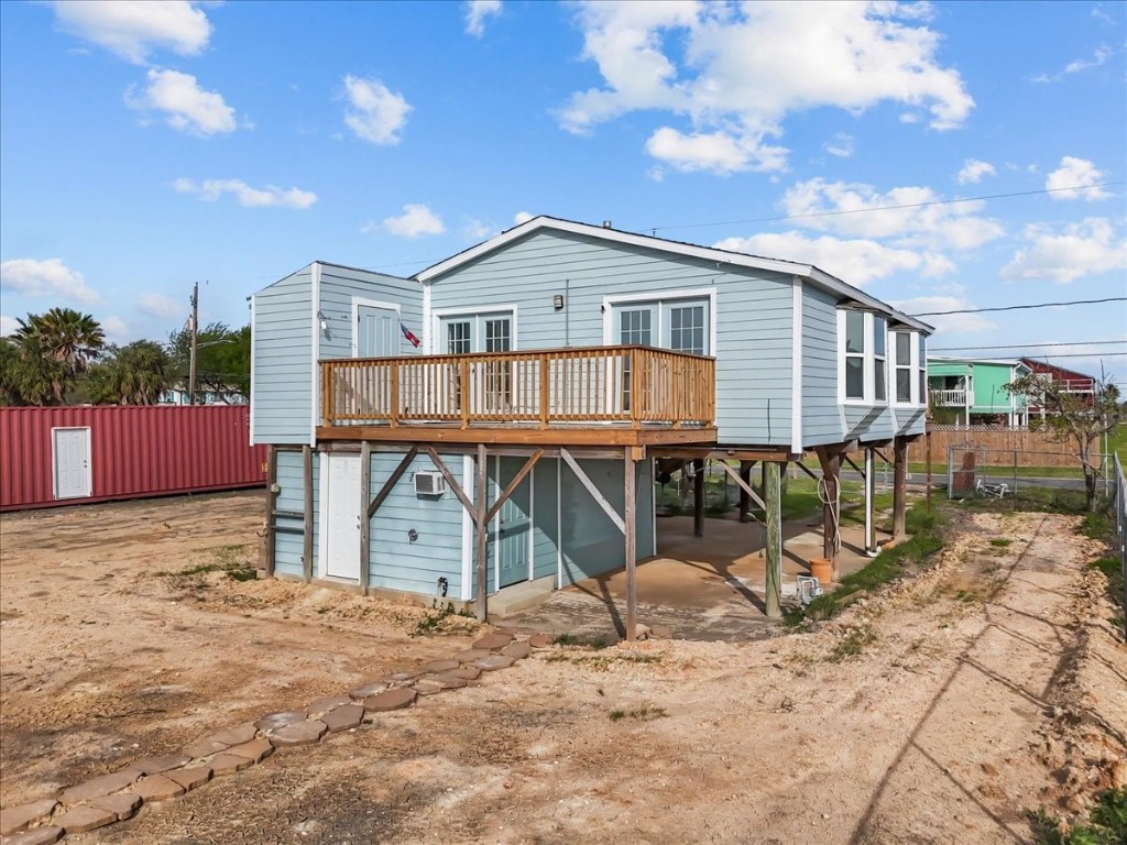 1048 16th Street Dickinson, TX 77539 - Photo 22 of 28 a front view of a house with a wooden deck