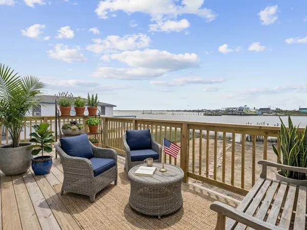 a balcony with furniture and city view