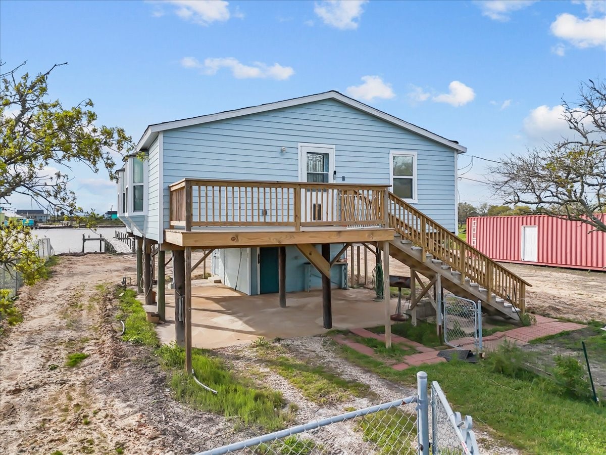 1048 16th Street Dickinson, TX 77539 - Photo 5 of 28 a view of a house with backyard and deck