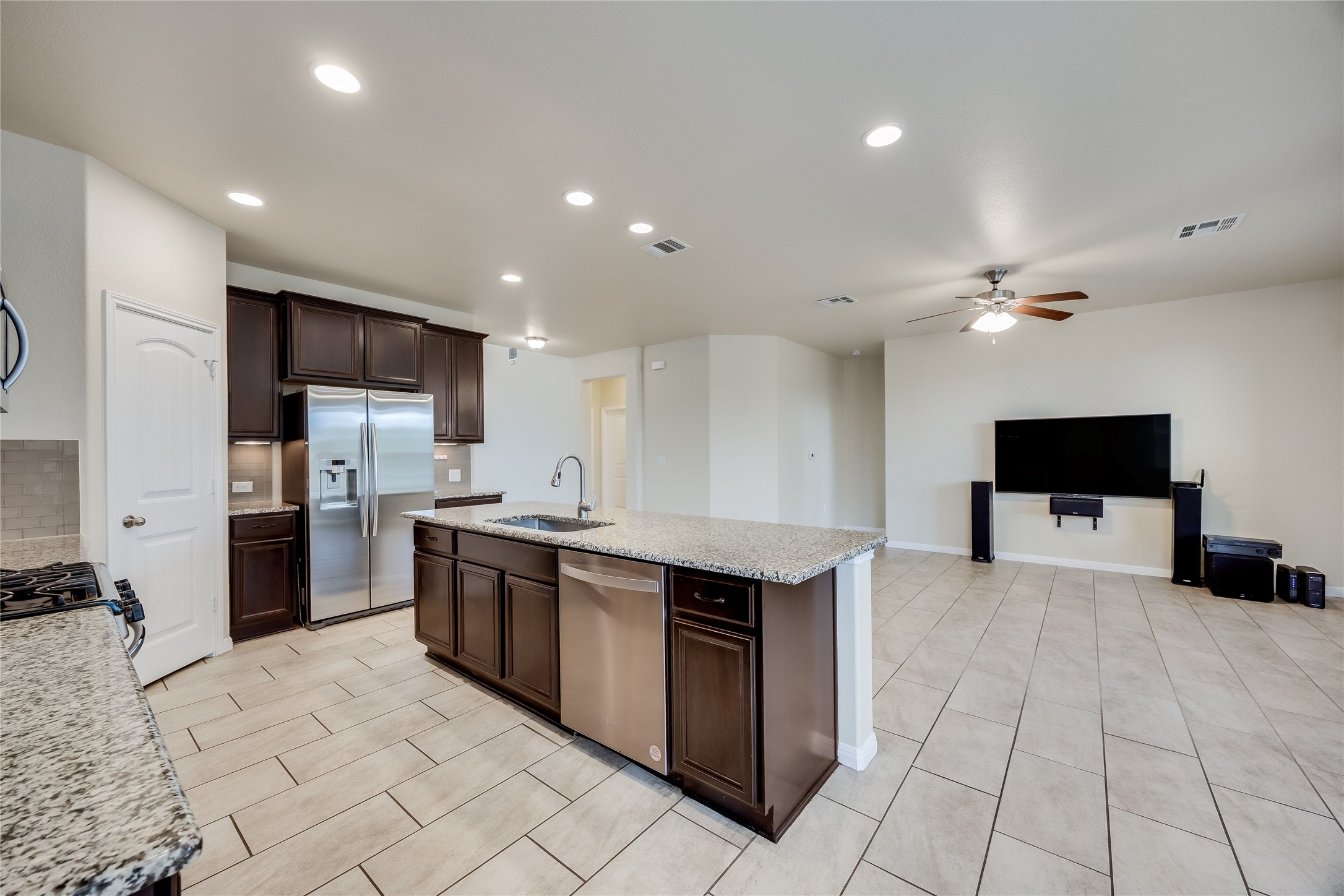 11328 Reading Way Austin, TX 78717 - Photo 11 of 37 a large kitchen with stainless steel appliances a sink a stove and a refrigerator