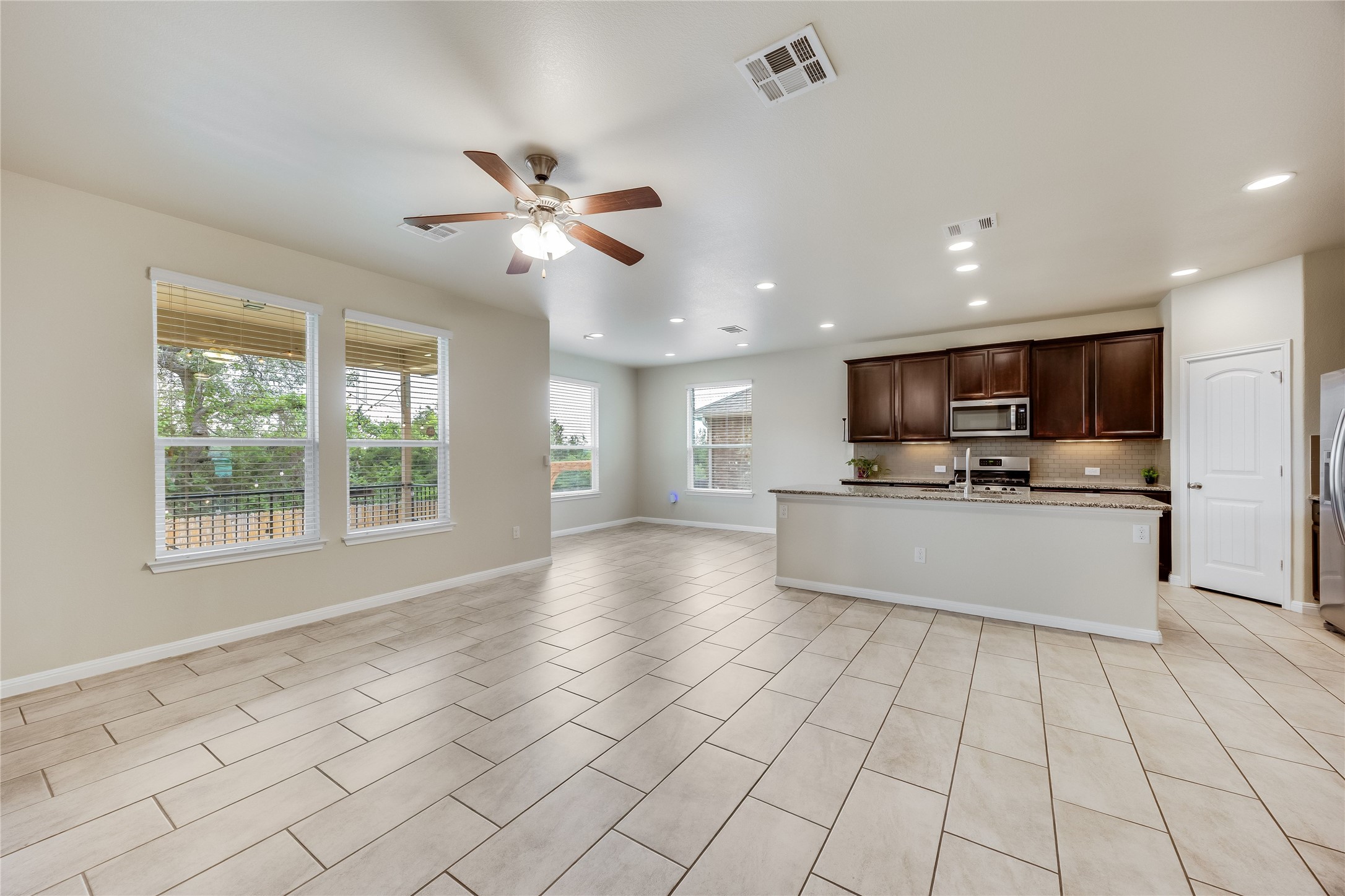 11328 Reading Way Austin, TX 78717 - Photo 13 of 37 a view of kitchen with windows and ceiling fan