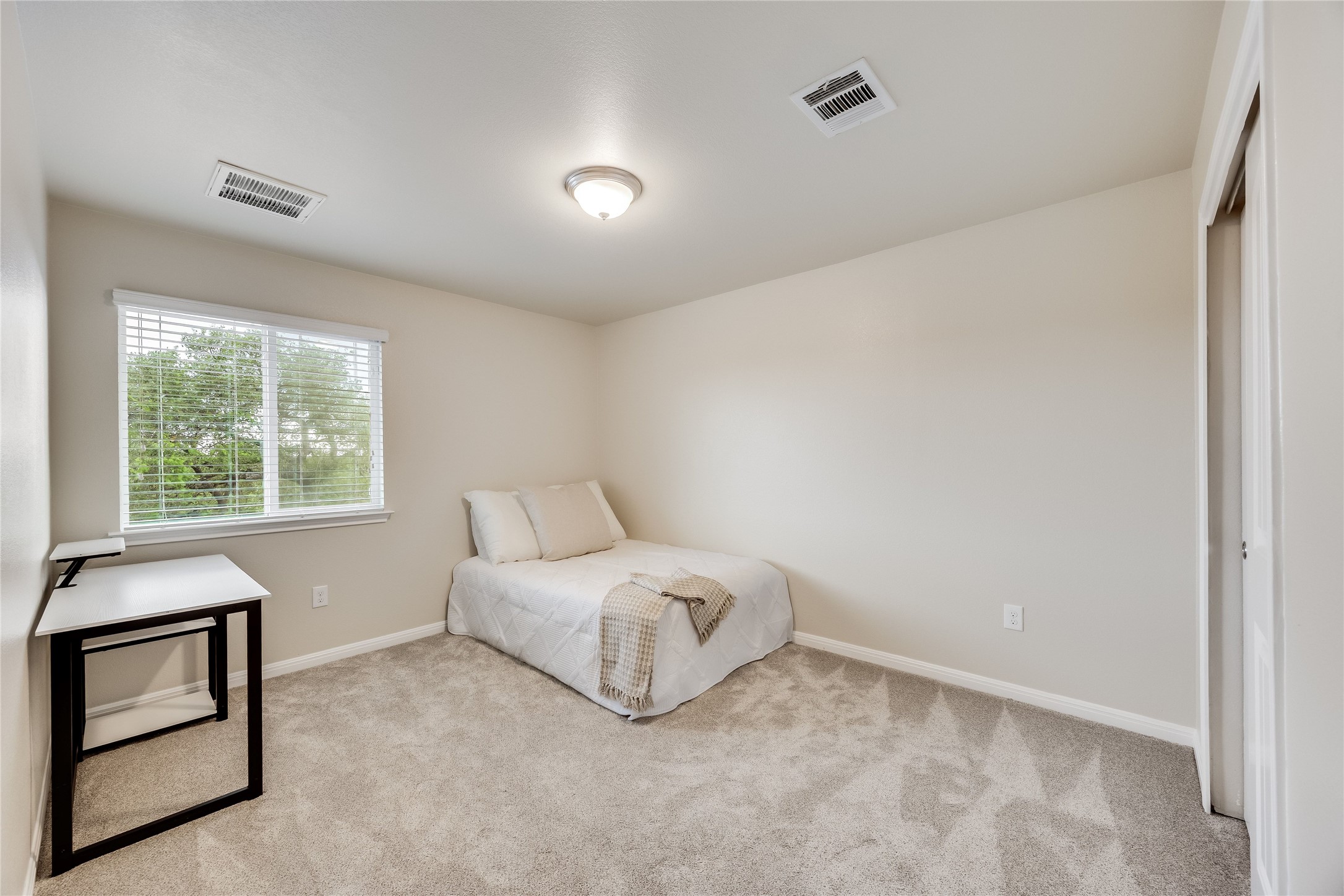 11328 Reading Way Austin, TX 78717 - Photo 22 of 37 a room with a bed and a window