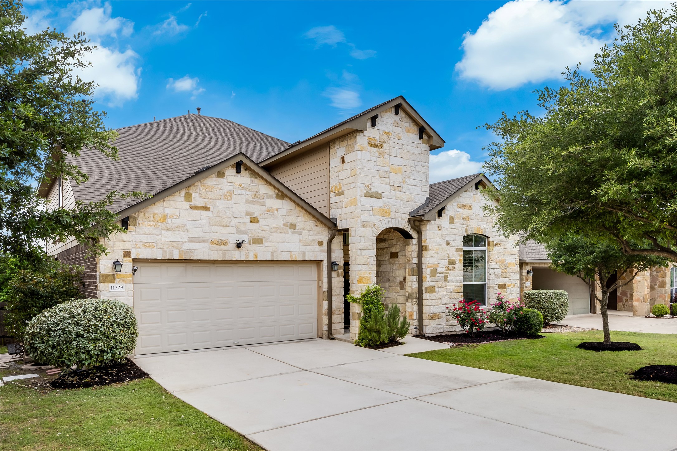 11328 Reading Way Austin, TX 78717 - Photo 3 of 37 a front view of a house with garden