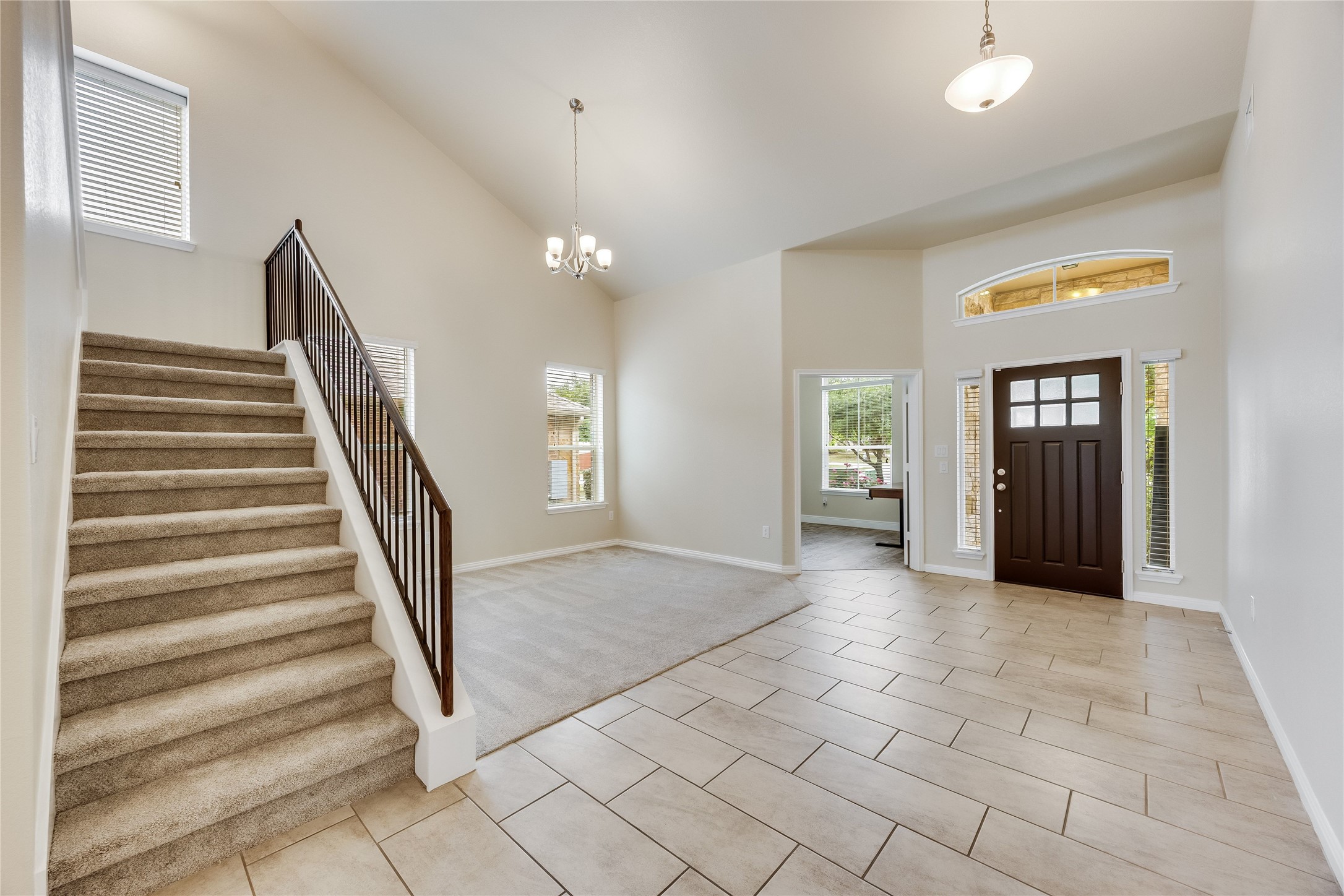 11328 Reading Way Austin, TX 78717 - Photo 4 of 37 a view of a hallway with entryway and stairs