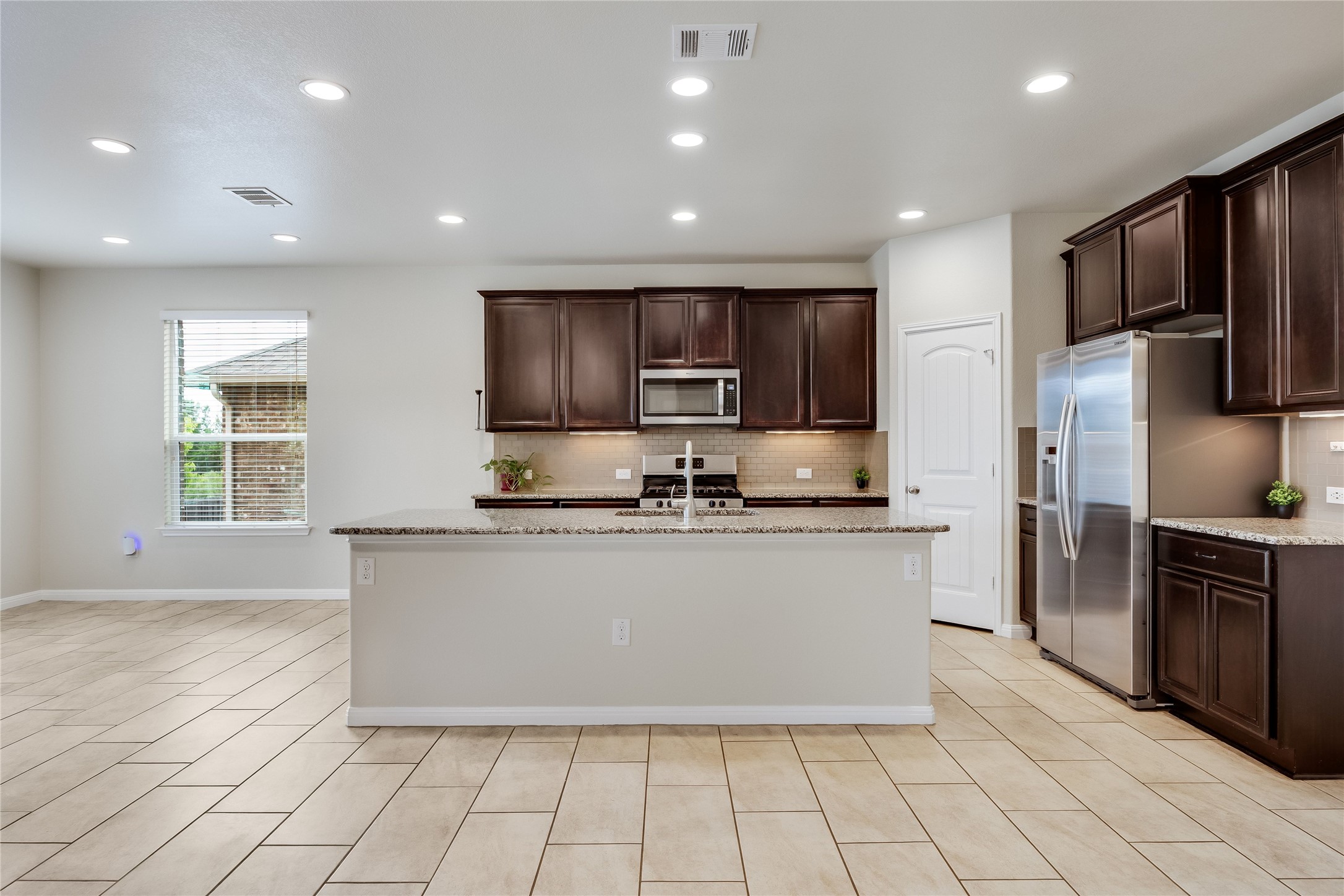 11328 Reading Way Austin, TX 78717 - Photo 9 of 37 a kitchen with stainless steel appliances granite countertop a refrigerator and a sink