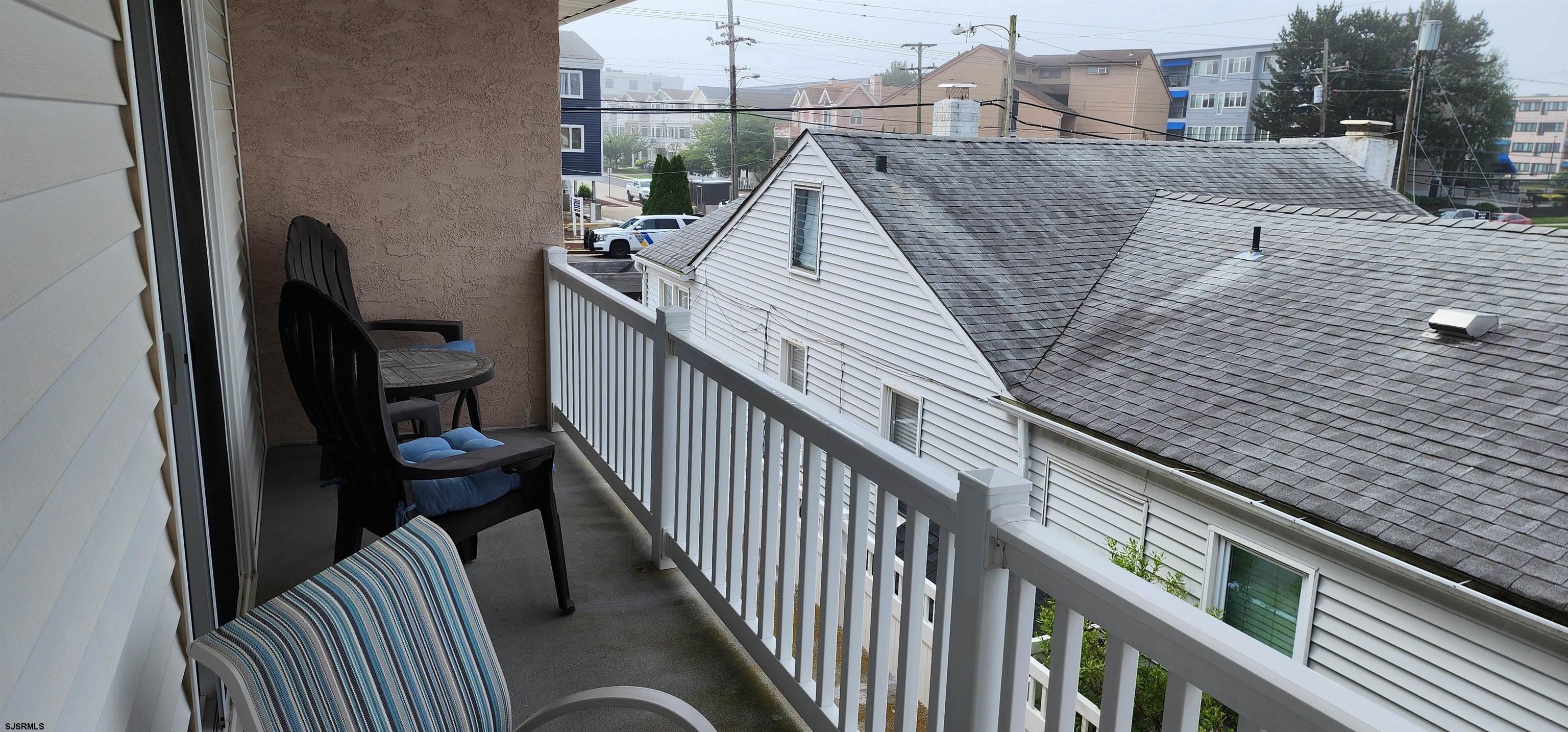 4313 West Brigantine Avenue, Unit 3 Brigantine, NJ 08203 - Photo 12 of 15 a balcony of a house with wooden floor and stairs