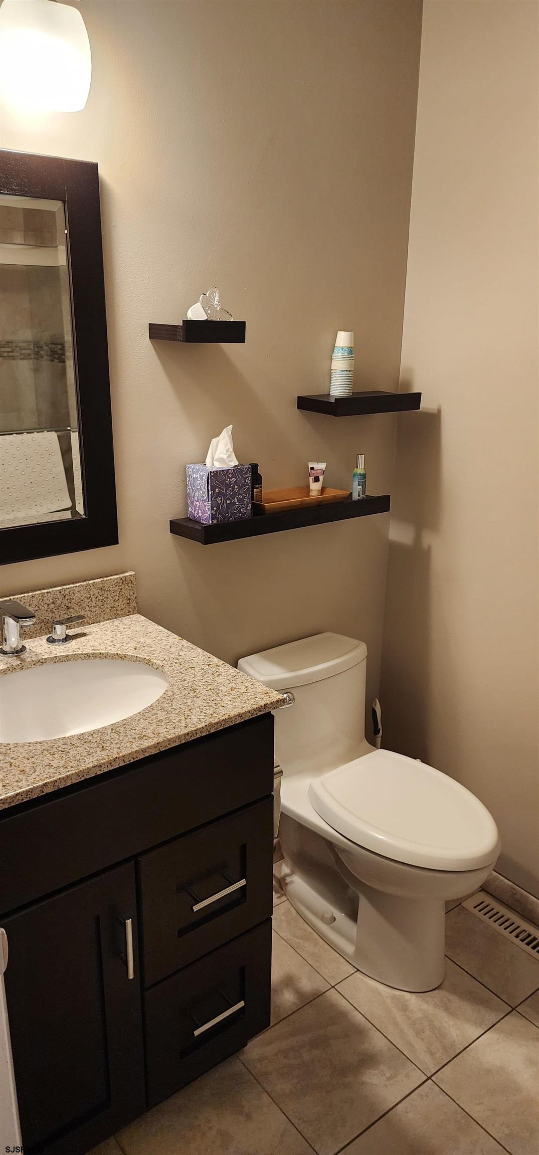 4313 West Brigantine Avenue, Unit 3 Brigantine, NJ 08203 - Photo 9 of 15 a bathroom with a sink and a toilet