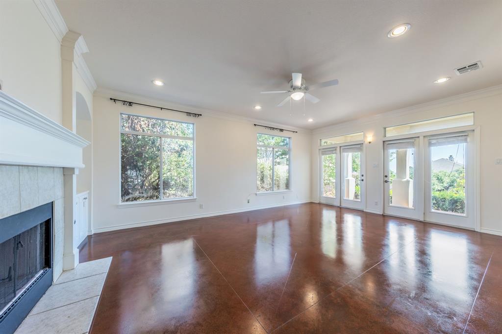1704 Randolph Ridge Trail Austin, TX 78746 - Photo 10 of 23 Unfurnished living room featuring recessed lighting, a ceiling fan, ornamental molding, and baseboards