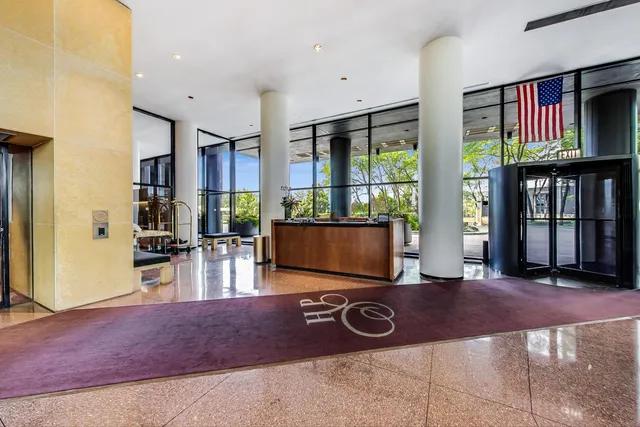 an outdoor swimming pool with seating