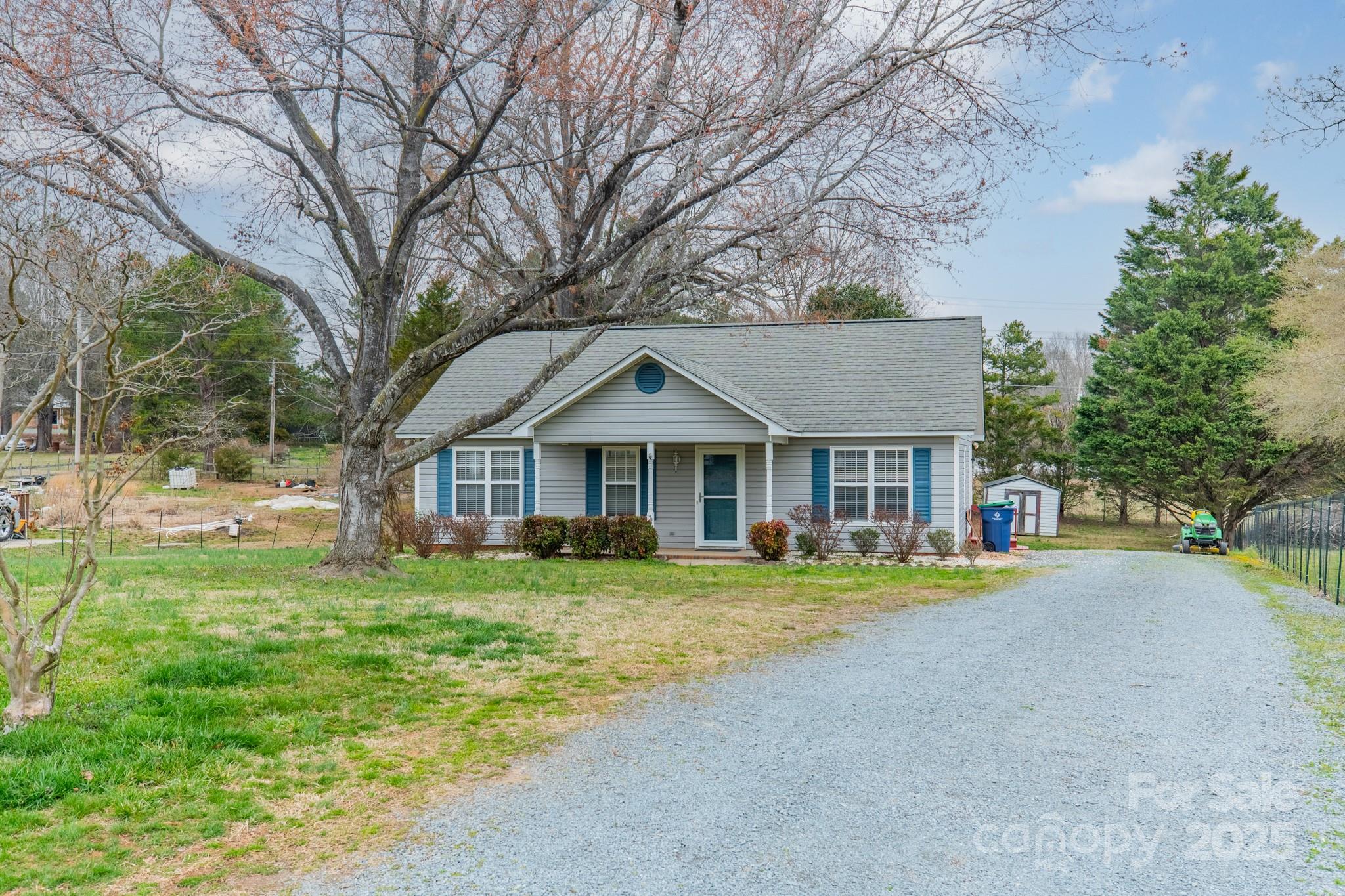 3414 Clearview Drive Monroe, NC 28110 - Photo 1 of 13 a front view of a house with a yard and trees