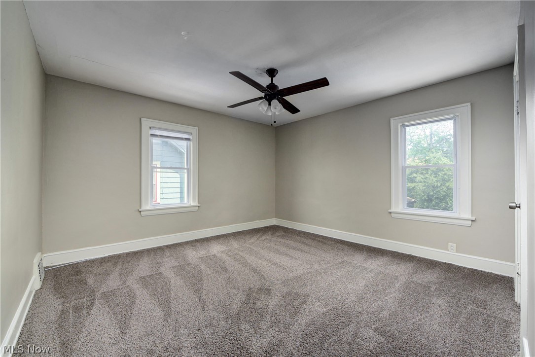 2115 Marlindale Road Cleveland Heights, OH 44118 - Photo 11 of 19 Unfurnished room with dark colored carpet and ceiling fan