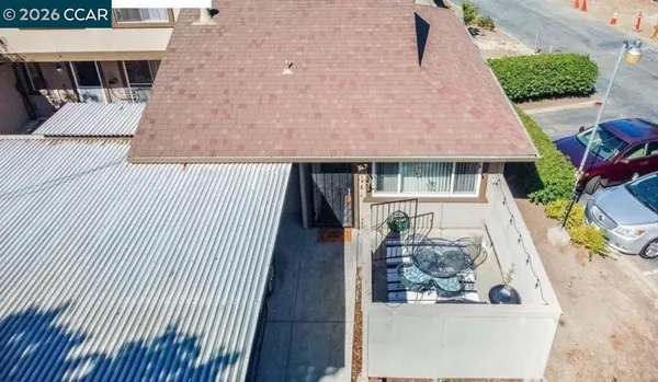 an aerial view of a house with wooden floor