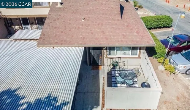 an aerial view of a house with wooden floor