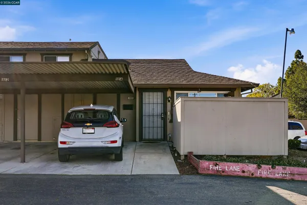 a car parked in front of a house