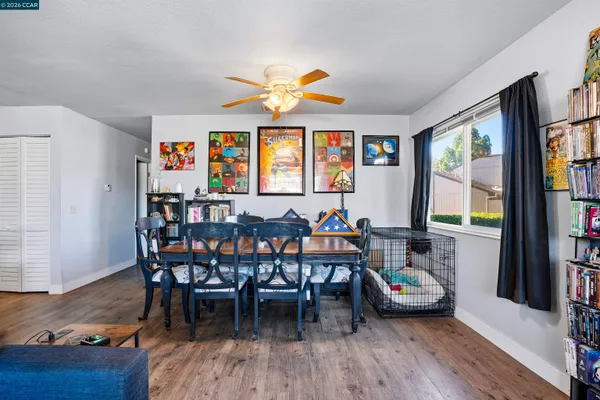 a view of a livingroom with furniture window and wooden floor