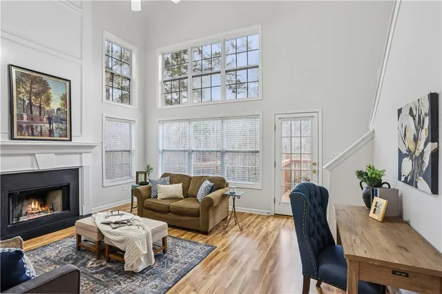 a living room with furniture a fireplace and a table