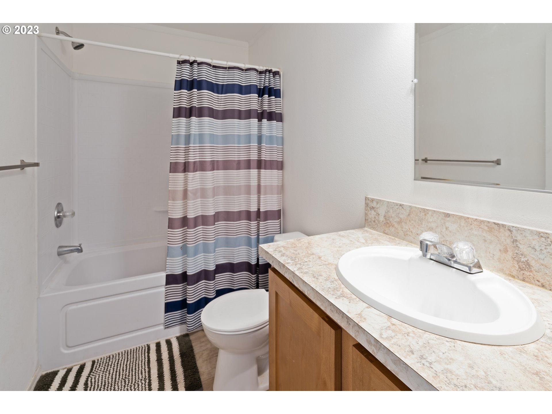 1383 Taney Street Eugene, OR 97402 - Photo 11 of 23 a bathroom with a sink a toilet and shower