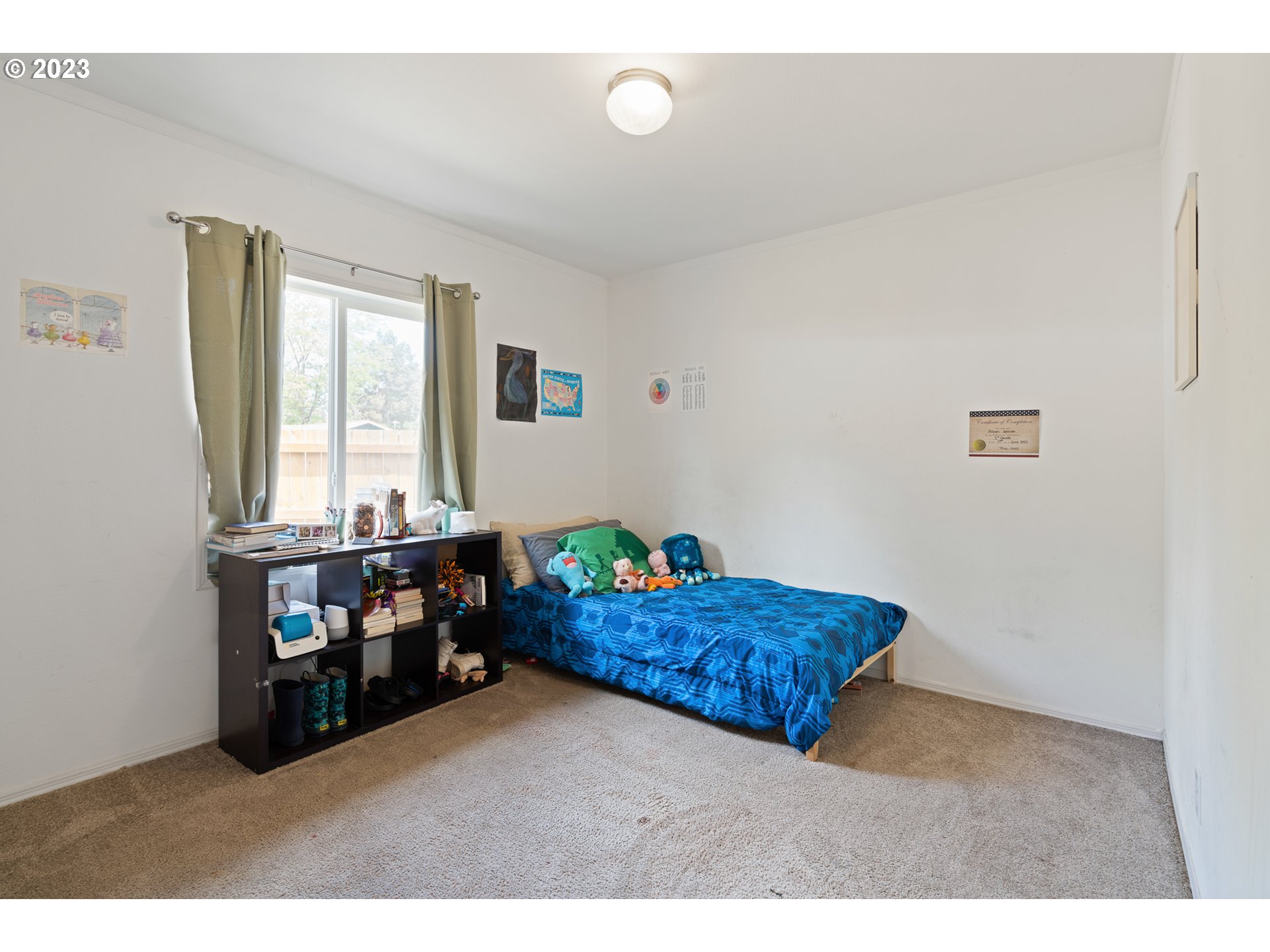 1383 Taney Street Eugene, OR 97402 - Photo 12 of 23 a living room with a bed and a dresser