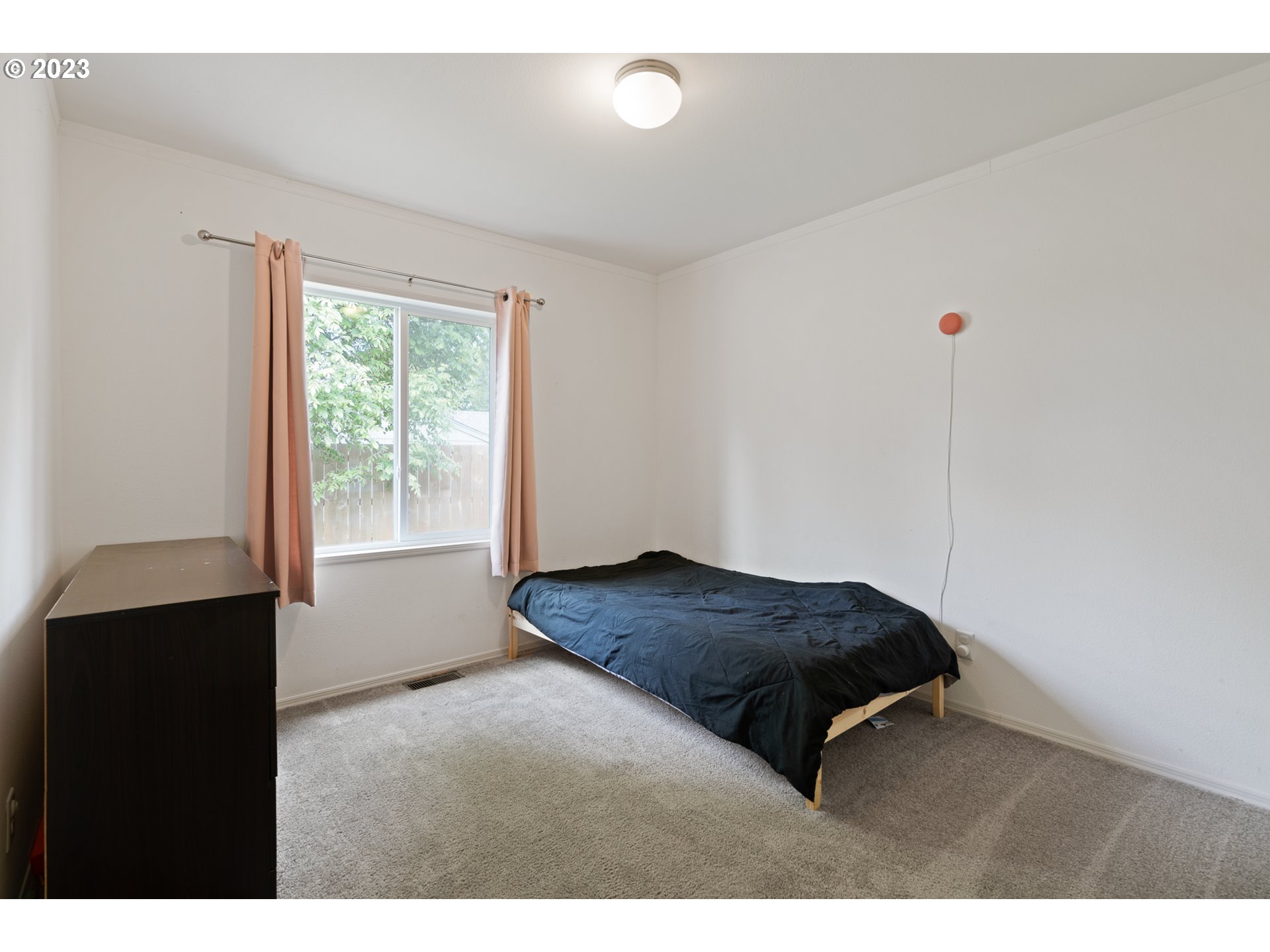 1383 Taney Street Eugene, OR 97402 - Photo 14 of 23 a bedroom with a bed and a window