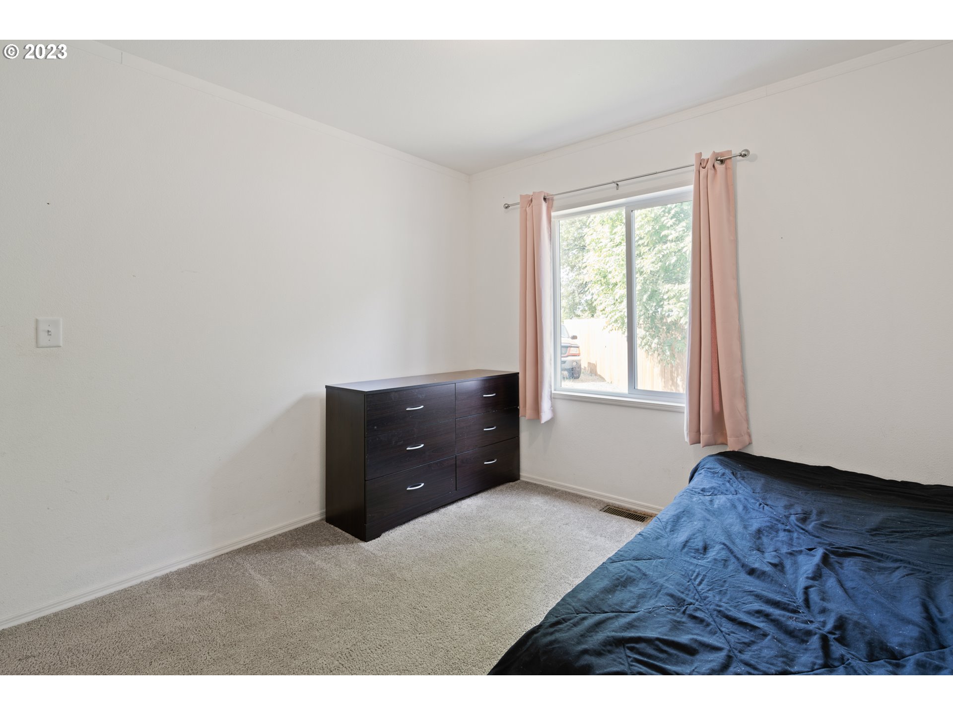 1383 Taney Street Eugene, OR 97402 - Photo 15 of 23 a room with a bed and a window