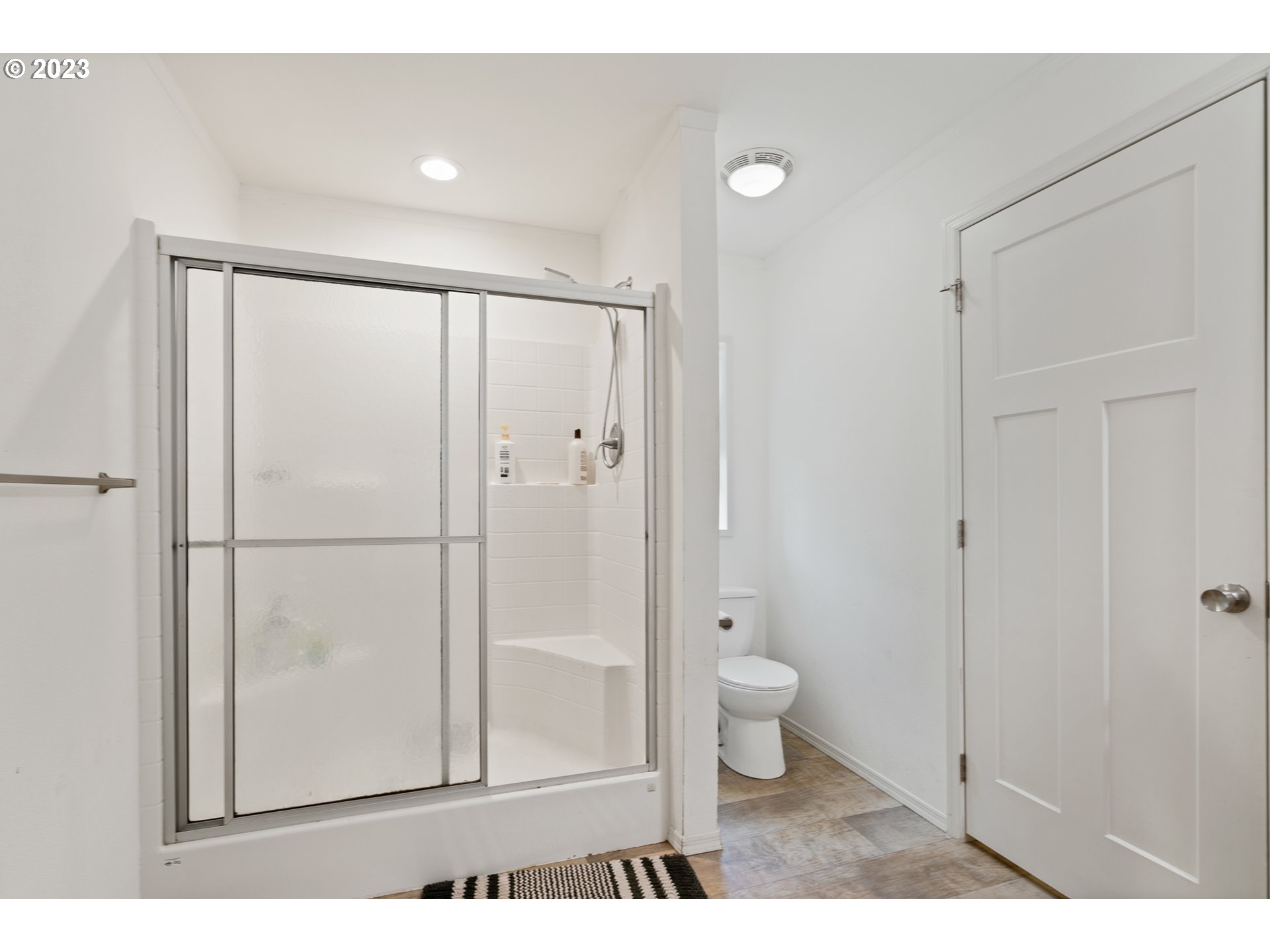 1383 Taney Street Eugene, OR 97402 - Photo 17 of 23 a bathroom with a toilet and a shower