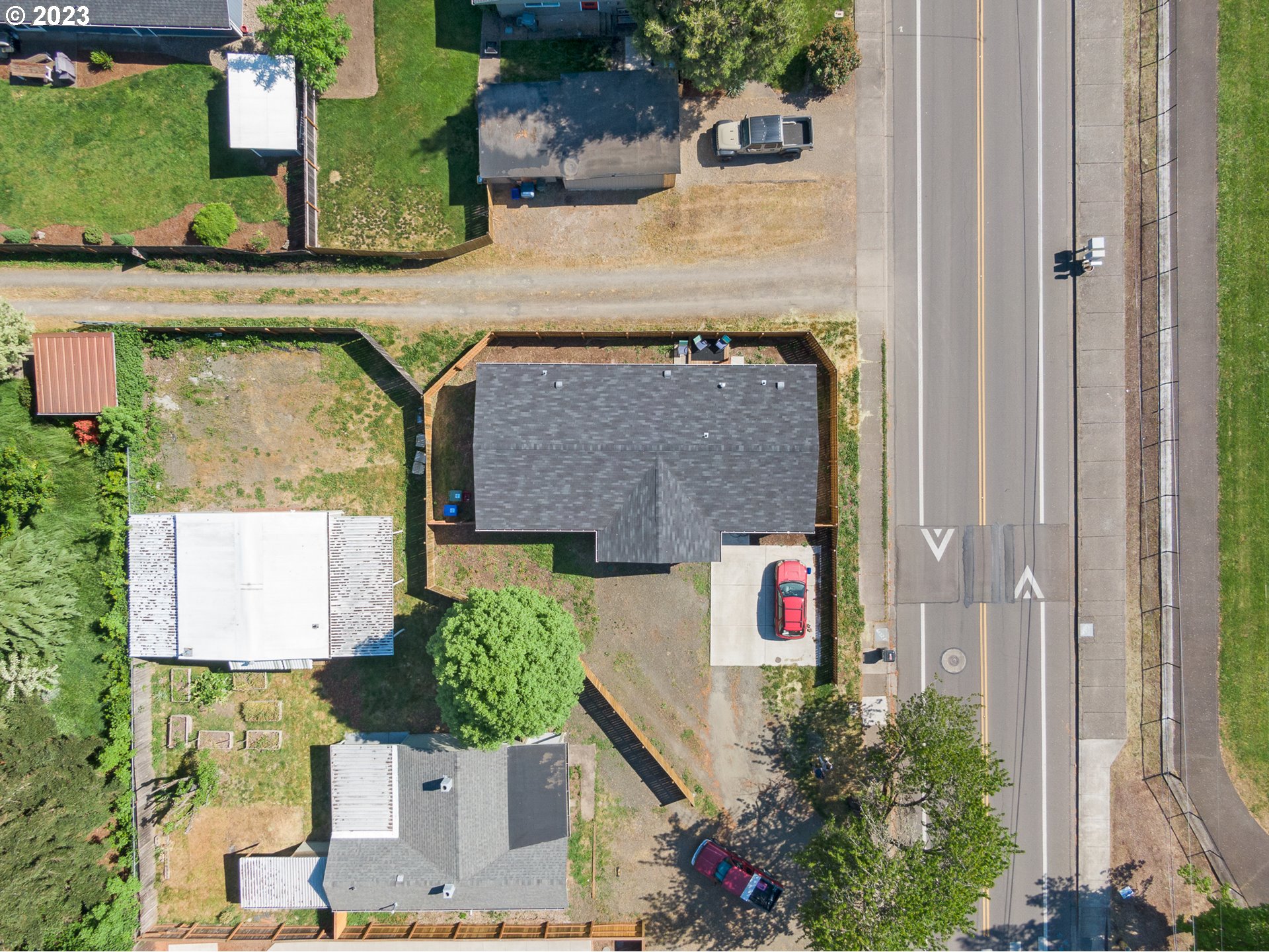 1383 Taney Street Eugene, OR 97402 - Photo 20 of 23 an aerial view of a house with a yard and potted plants