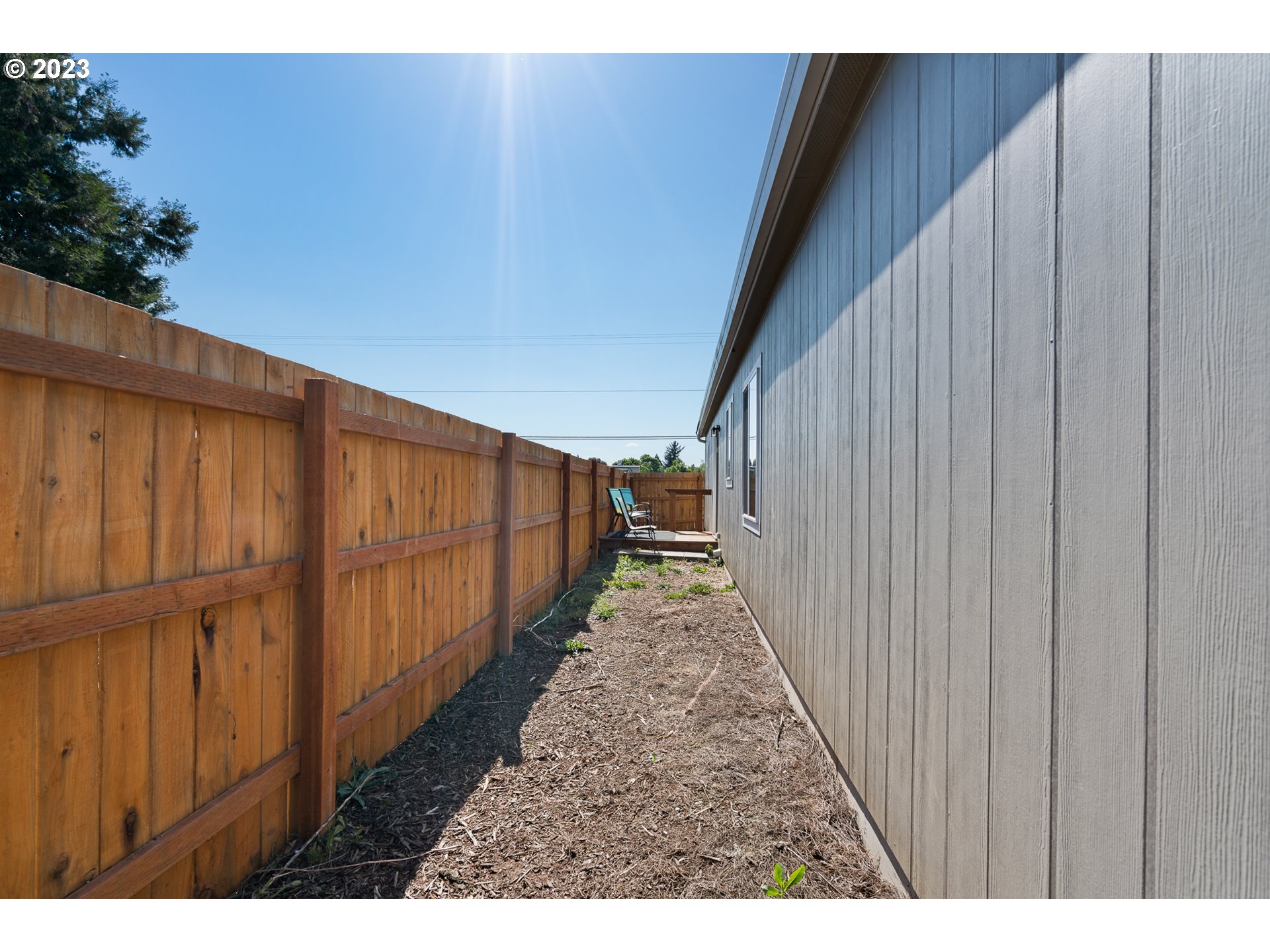1383 Taney Street Eugene, OR 97402 - Photo 21 of 23 a view of a pathway with a wooden fence