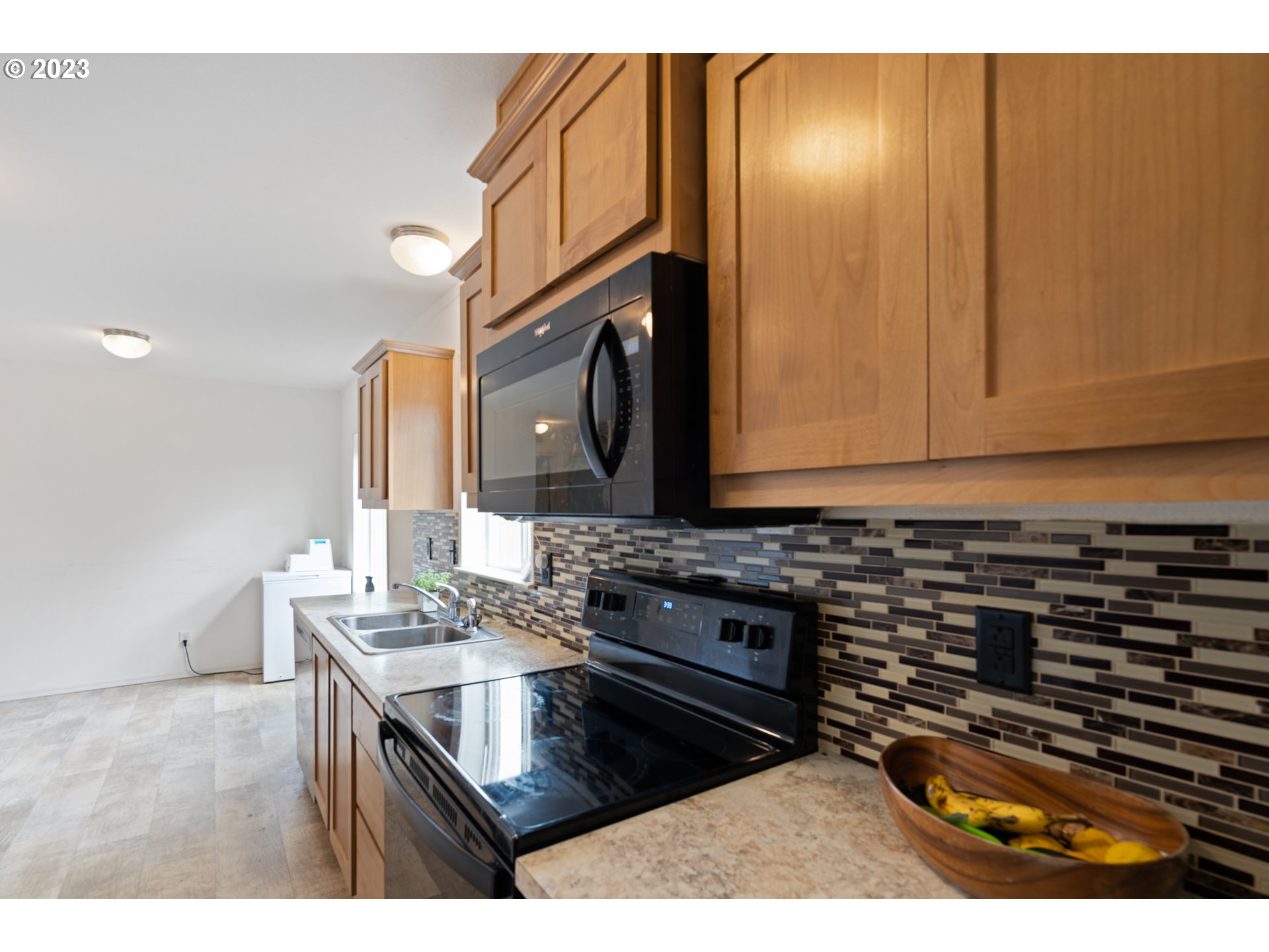 1383 Taney Street Eugene, OR 97402 - Photo 6 of 23 a kitchen with a sink a stove and cabinets