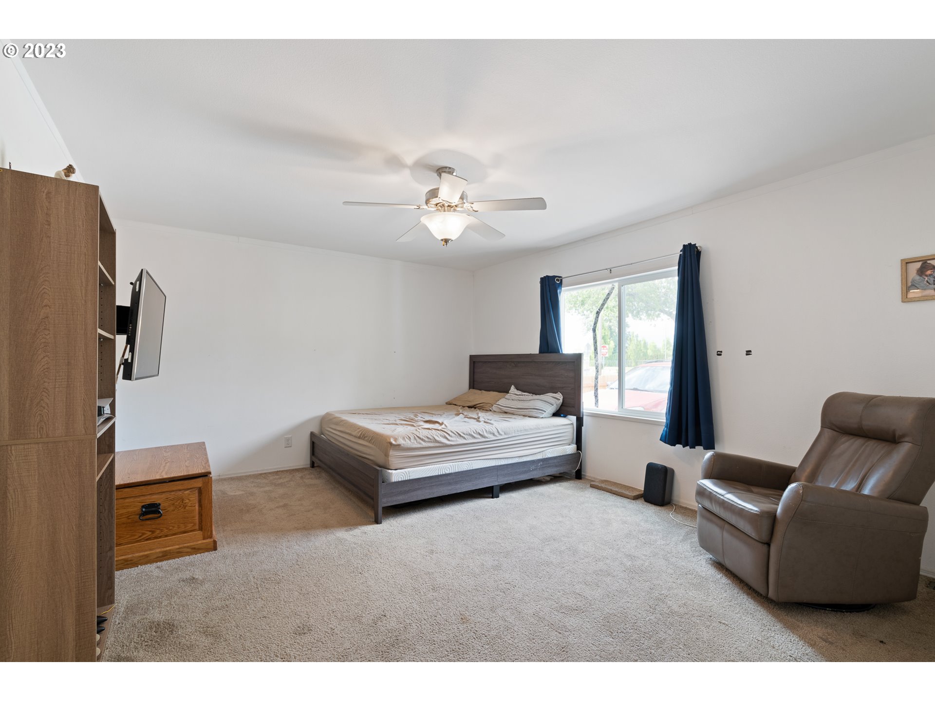 1383 Taney Street Eugene, OR 97402 - Photo 7 of 23 a living room with furniture and a flat screen tv