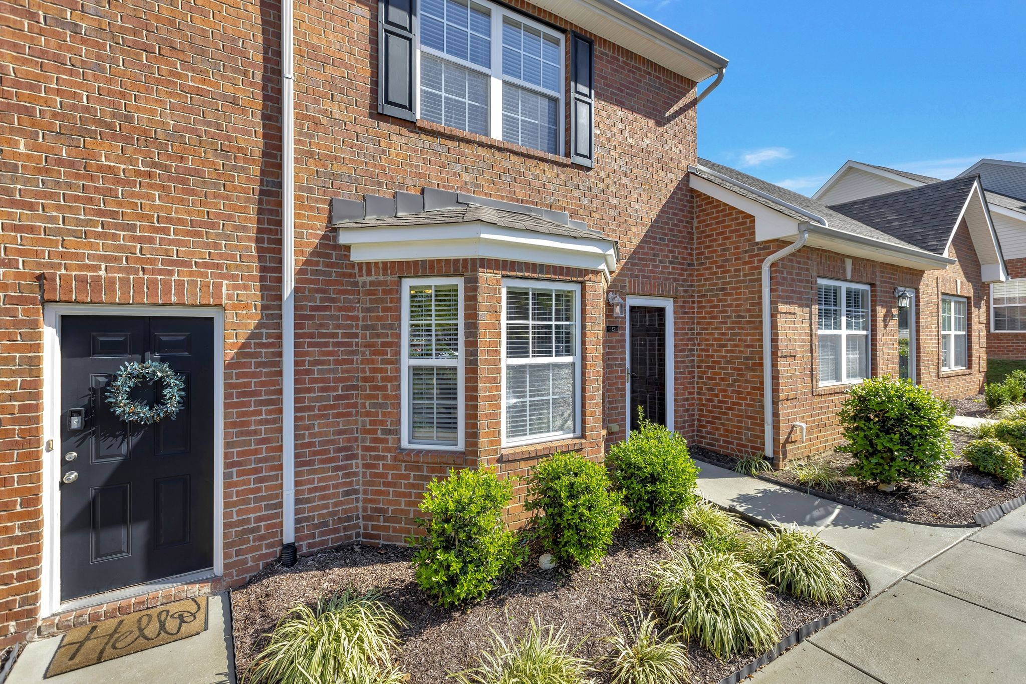 1101 Downs Boulevard, Unit 133 Franklin, TN 37064 - Photo 3 of 23 a front view of a house with garden