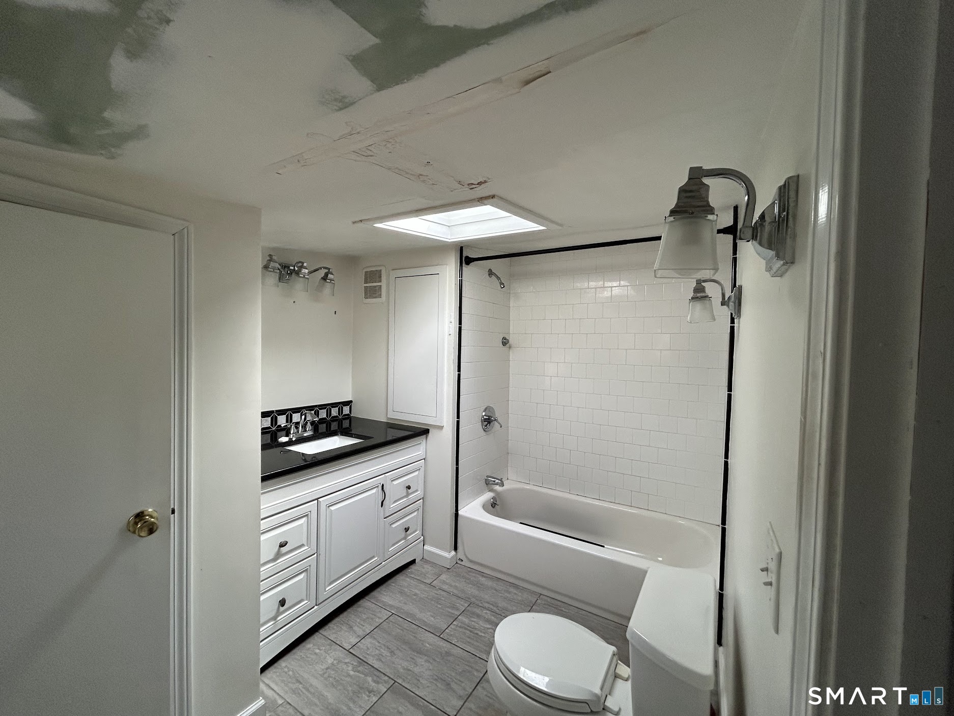 236 Wire Mill Road Stamford, CT 06903 - Photo 6 of 11 a bathroom with a granite countertop sink toilet and shower