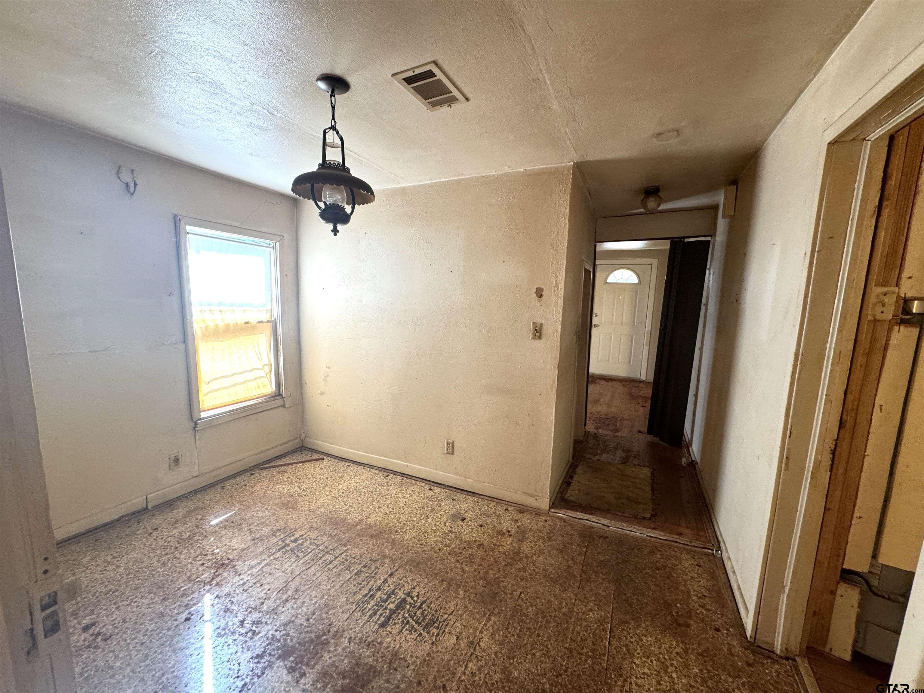 2017 West Jackson Street Tyler, TX 75701 - Photo 11 of 24 a view of empty room with wooden floor and fan