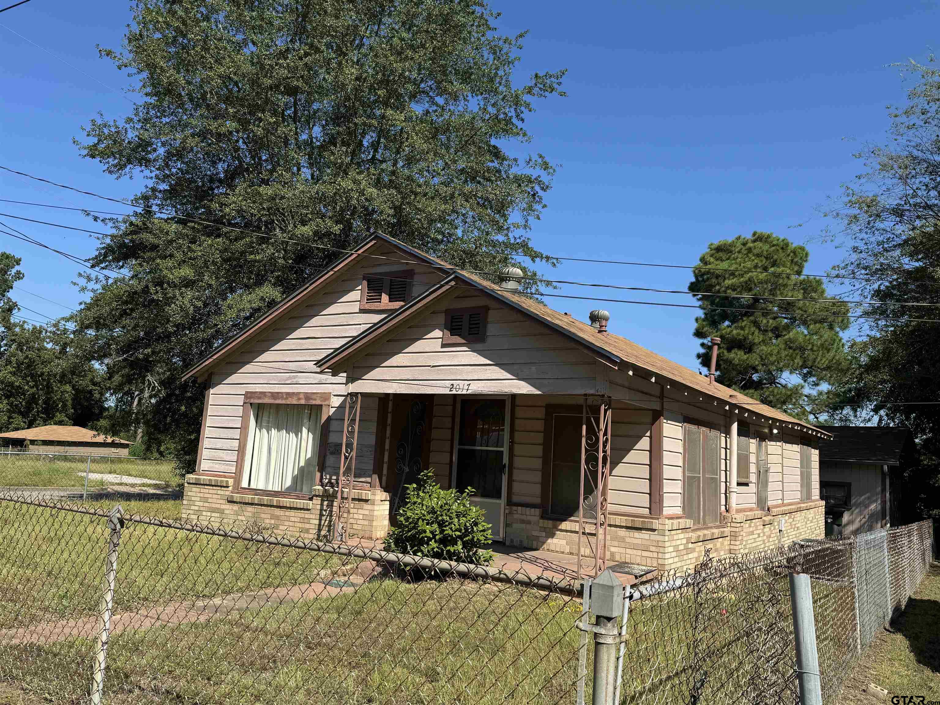 2017 West Jackson Street Tyler, TX 75701 - Photo 17 of 24 a front view of a house with garden