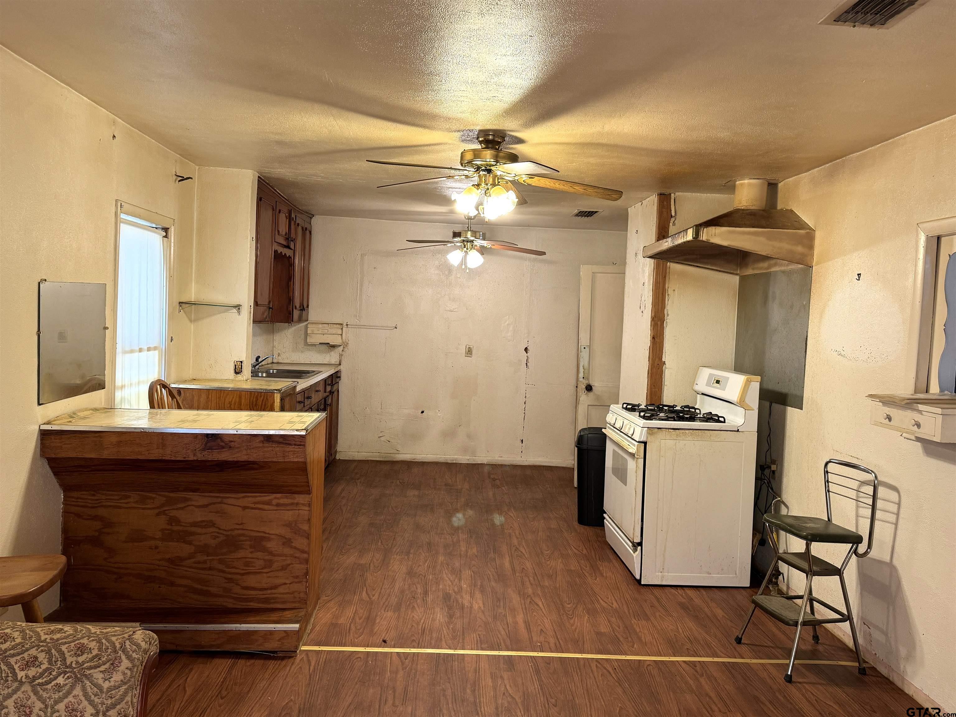 2017 West Jackson Street Tyler, TX 75701 - Photo 3 of 24 a kitchen with a sink appliances and cabinets