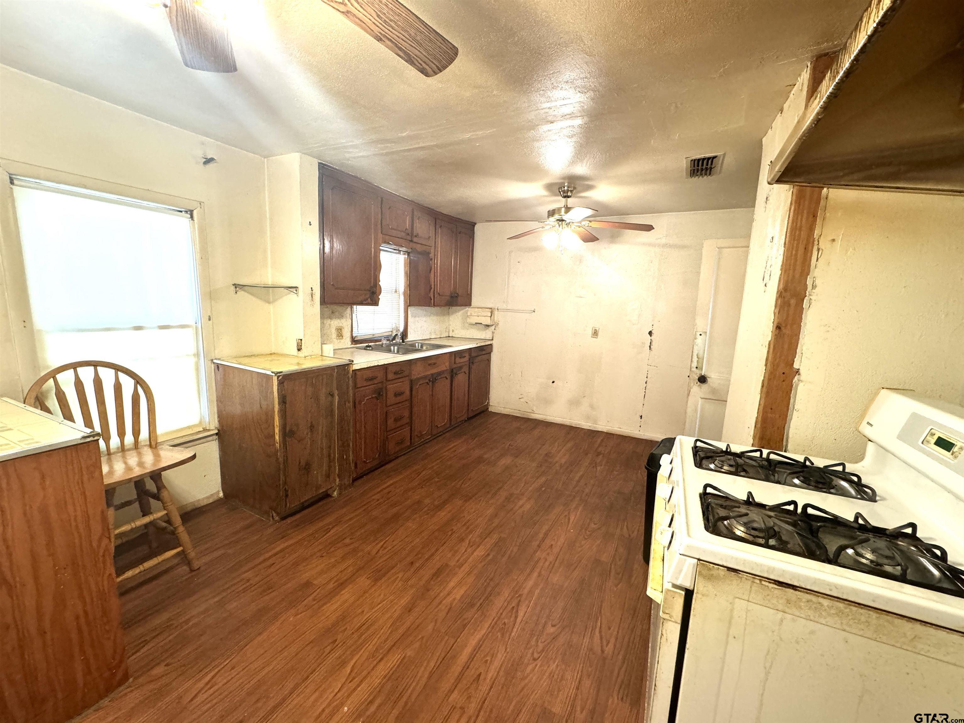 2017 West Jackson Street Tyler, TX 75701 - Photo 6 of 24 a kitchen with wooden floors and sink