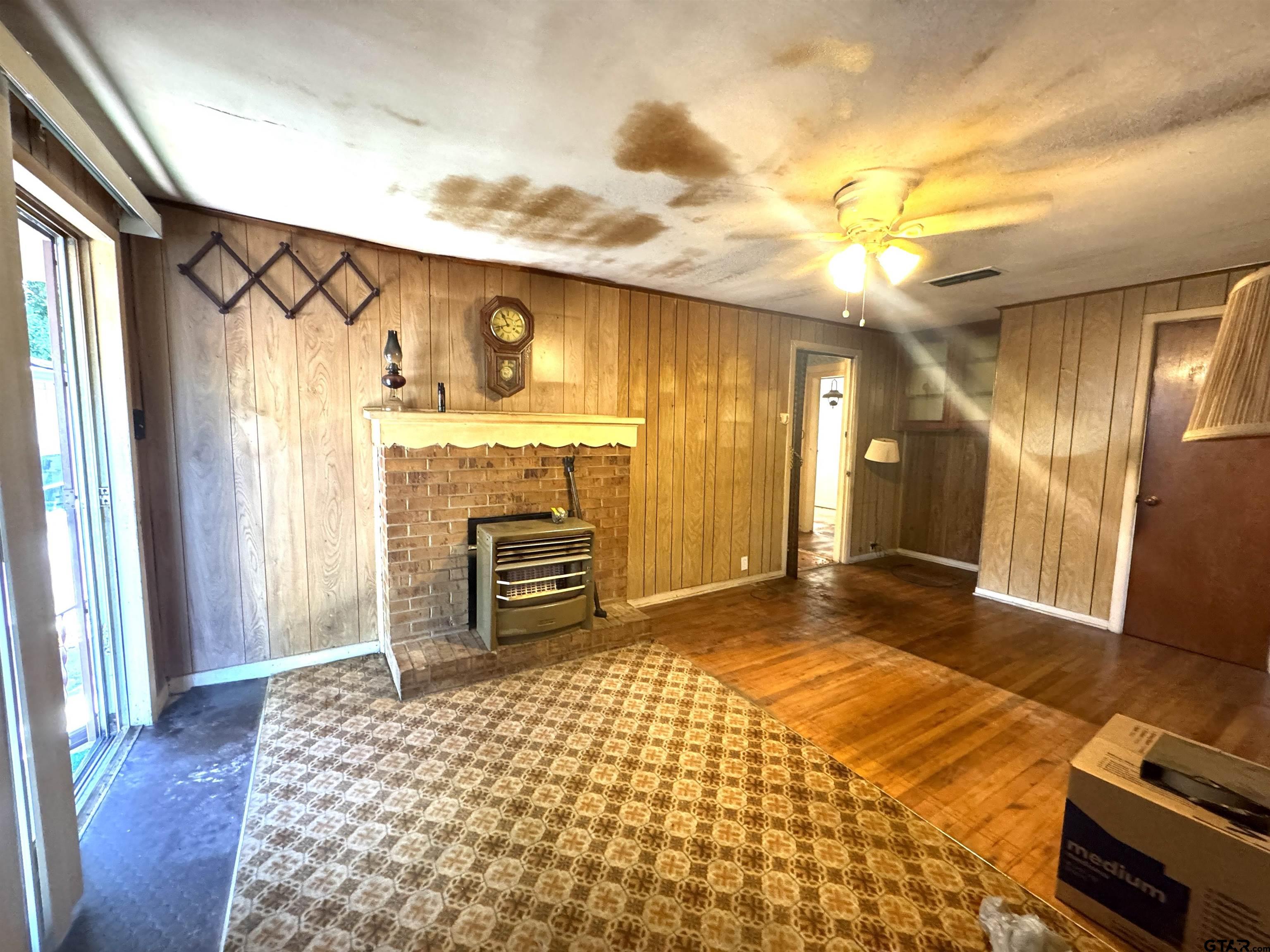 2017 West Jackson Street Tyler, TX 75701 - Photo 7 of 24 a view of a livingroom with wooden floor and a ceiling fan