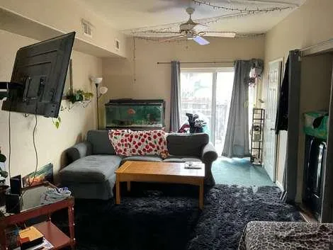 a bedroom with a bed and a lamp on table