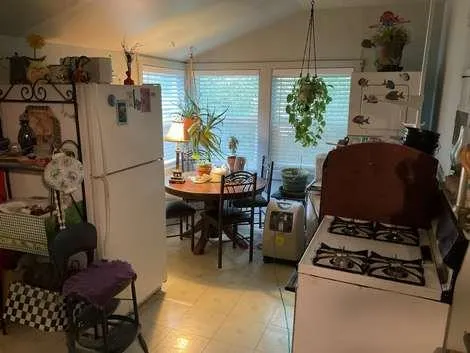 a bedroom with a bed and a flat tv screen
