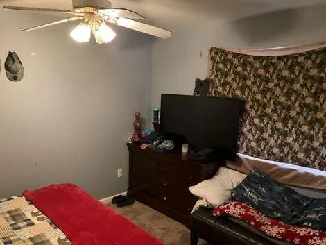 a living room with furniture and a window