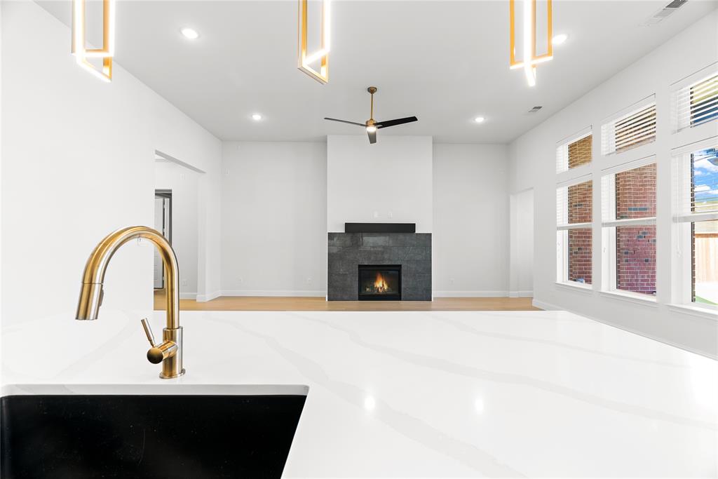 4405 Rosedale Street Prosper, TX 75078 - Photo 9 of 40 a view of a livingroom with a fireplace and a window